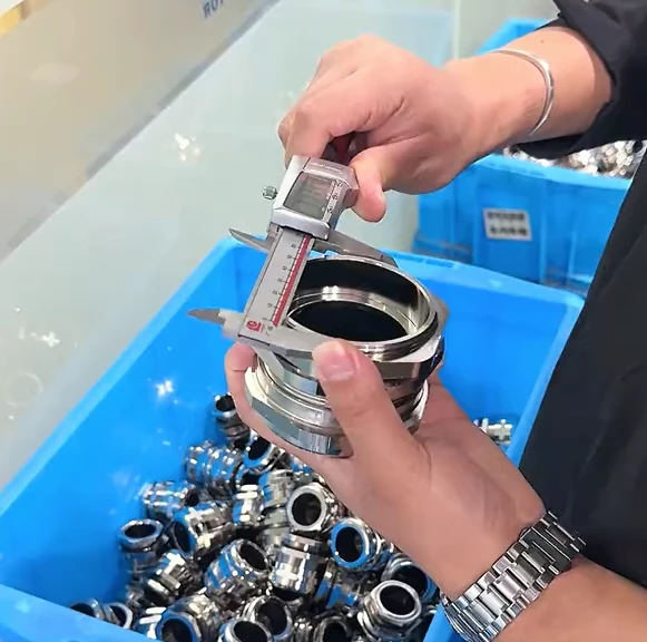 Digital caliper checking the internal diameter of a metal cable entry component