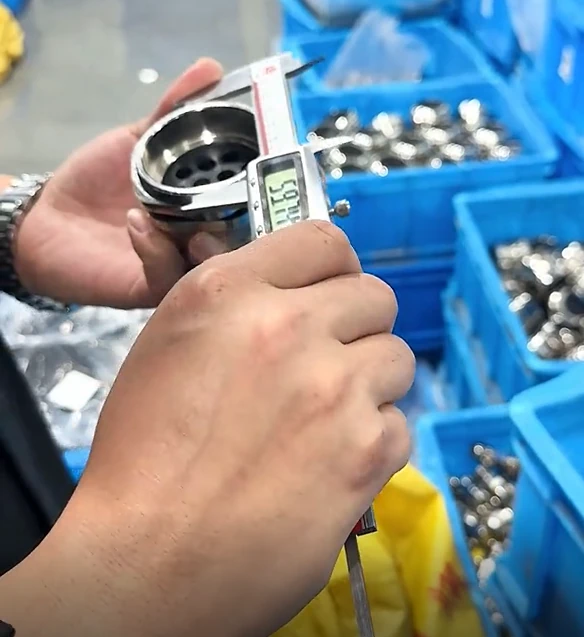 Digital caliper reading during metal cable gland component inspection