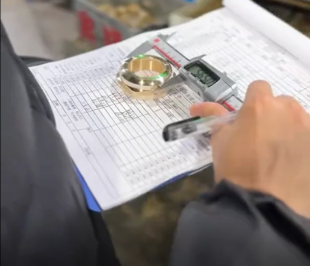 Digital caliper dimensional inspection recorded on a product inspection sheet